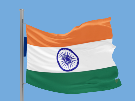 Flag of India waving against a blue sky
