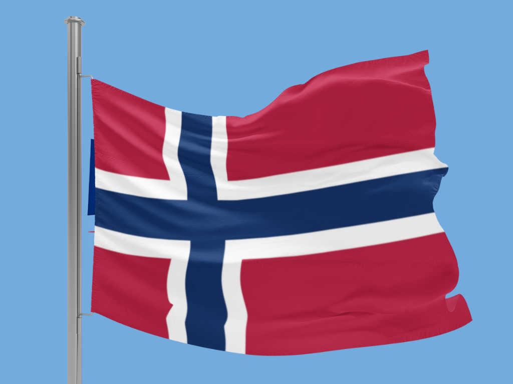 Flag of Norway waving against a clear blue sky