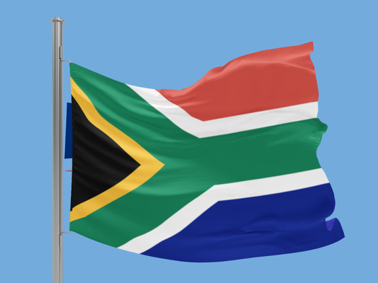 South African flag waving against a clear blue sky