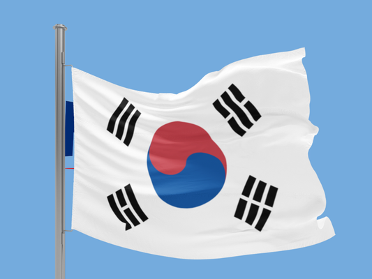 South Korean flag waving against a clear blue sky