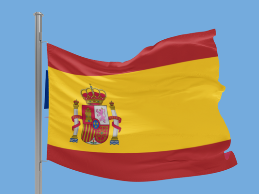 Flag of Spain with a blue sky background