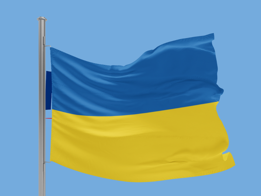 Flag of Ukraine waving against a clear blue sky