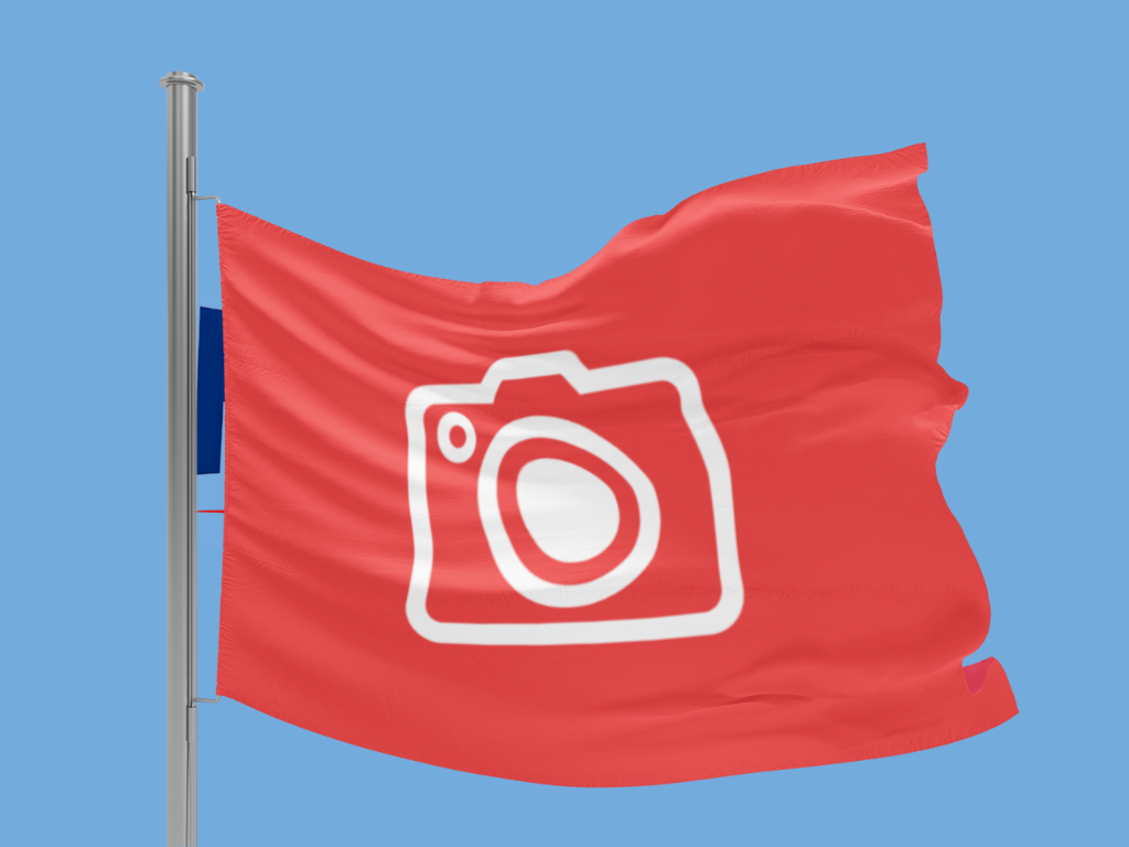 Red flag with a white camera icon on a blue background